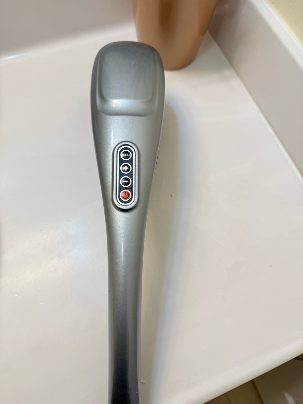 Silver Handheld Percussion Massager with Adjustable Intensity